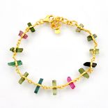 A 925 silver gilt bracelet set with rough mixed colour tourmalines, L. 21cm.