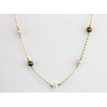 An 18ct yellow gold pearl set necklace, L. 42cm.