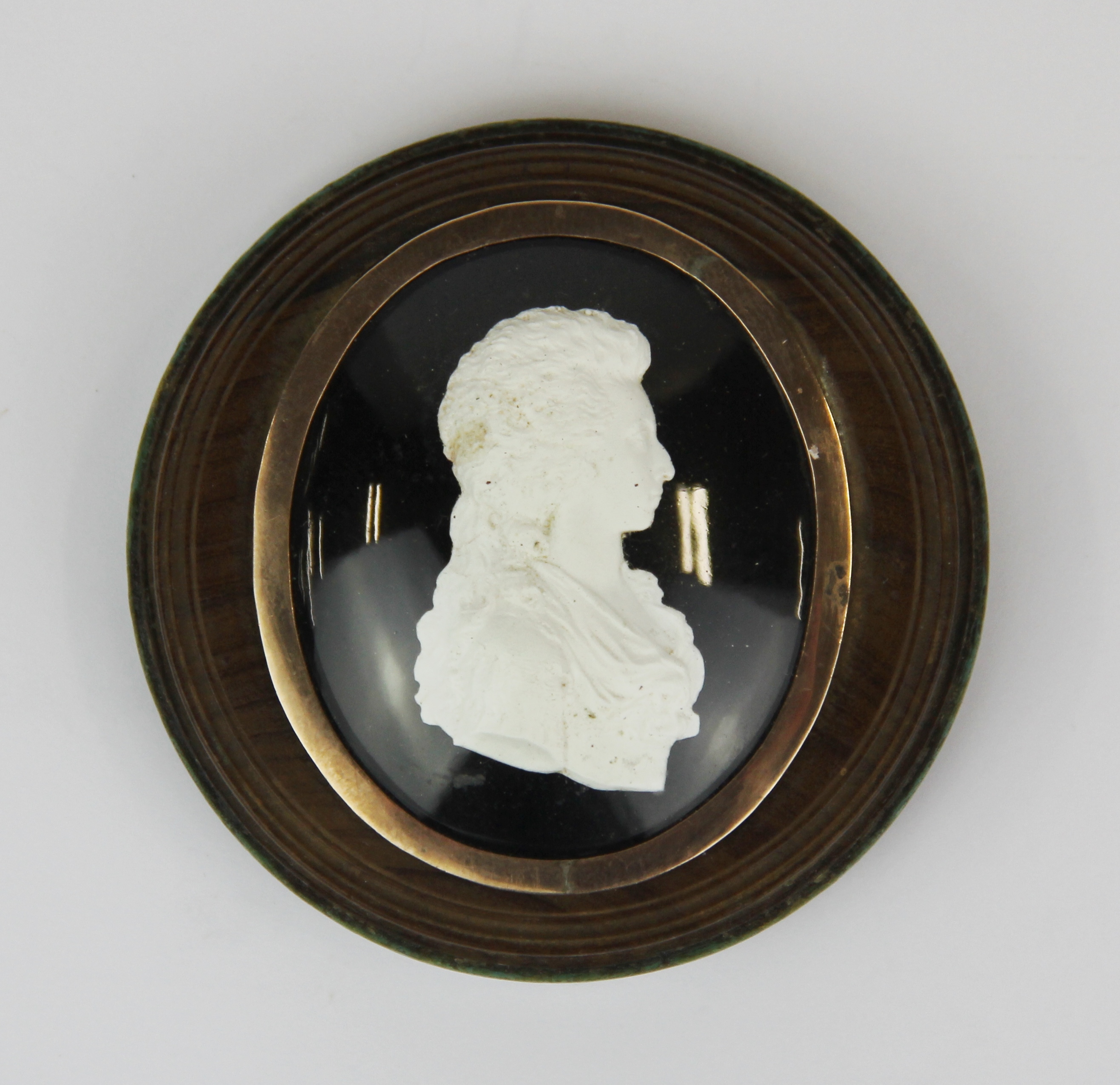 An interesting rose metal mounted (possibly gold) cameo portrait of Queen Charlotte, with a hand