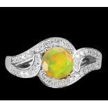 A matching 925 silver opal and white stone set ring.
