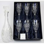 A boxed set of six Stuart crystal wine glasses together with a cut glass decanter.