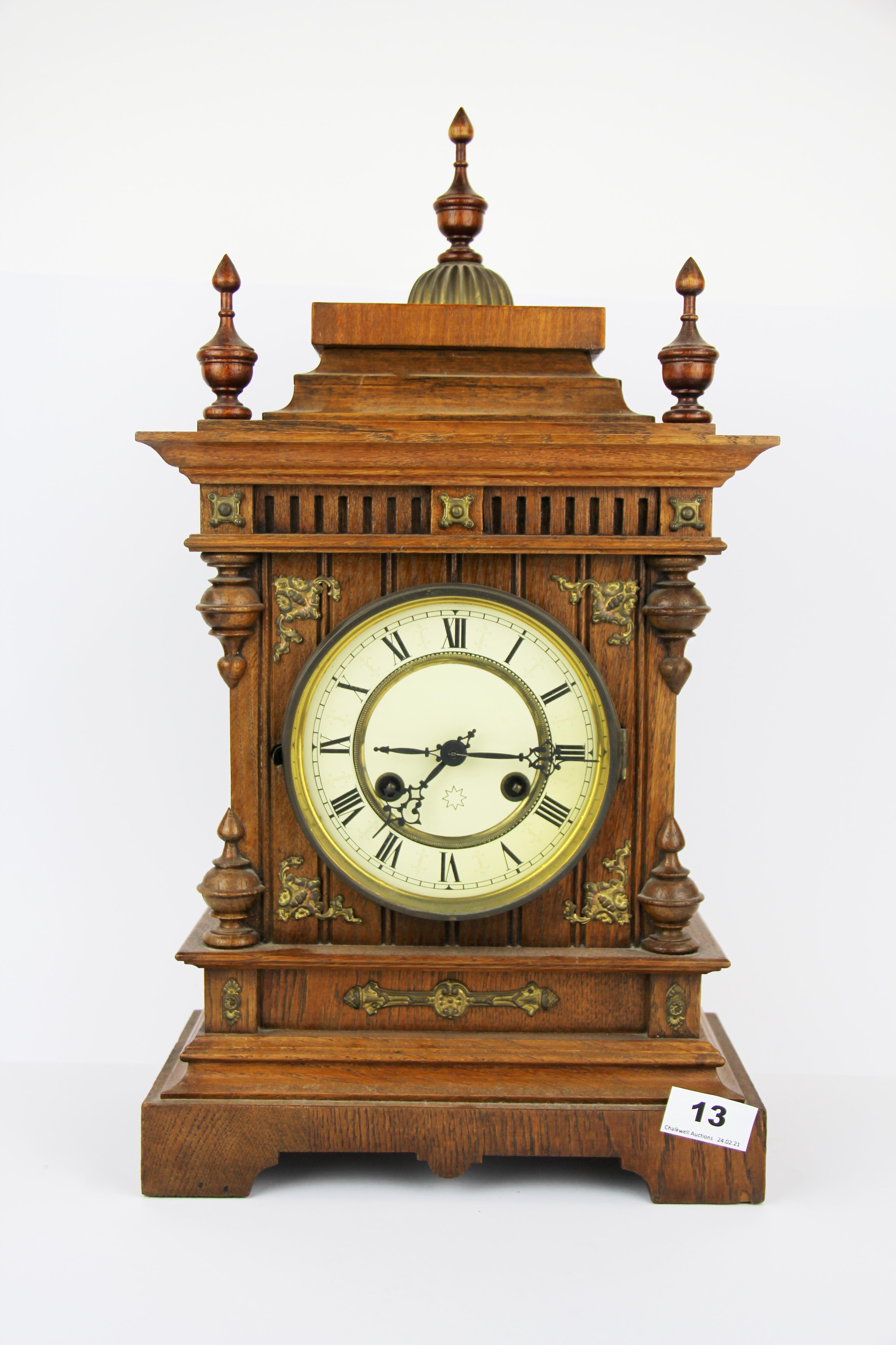 A Victorian oak mantle clock, H. 50cm.