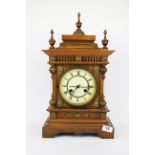 A Victorian oak mantle clock, H. 50cm.