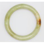 A polished jade bangle, Dia. 7.5cm.