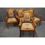 A set of four impressive Arts and Crafts period arm chairs.