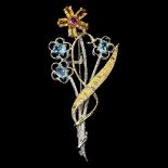 A 925 silver gilt flower shaped brooch set with blue topaz, citrine and rodolite garnets, L. 6cm.