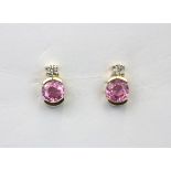 A pair of 14ct yellow gold earrings set with round cut fancy pink sapphires and diamonds, L. 1cm.