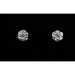 A pair of 18ct white gold diamond set cluster earrings, Dia. 0.5cm.