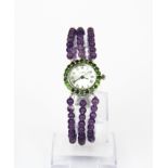 A 925 silver wrist watch with a chrome diopside set bezzle and polished amethyst bead adjustable