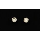 A pair of 900 platinum stud earrings set with brilliant cut diamonds, approx. 0.50ct overall.