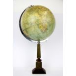A pre World War II Philips 10" Challenge Globe mounted on a brass pedestal, H. 49cm.