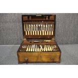 A vintage silver plated cutlery set in a walnut veneered case.