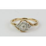 A 9ct yellow gold diamond set cluster ring, (P).
