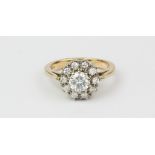 A 9ct yellow gold diamond set cluster ring, approx. 1ct overall, (L).