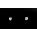 A pair o 9ct white gold diamond set stud earrings, approx. 0.50ct overall.