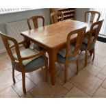 A heavy quality pine kitchen table with a set of 6 upholstered chairs, 91 x 146 x 78cm.