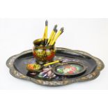 A Russian hand painted tin tray, small platter and a painted bowl and six wooden spoons, tray