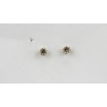 A pair of 18ct yellow gold diamond set stud earrings, approx. 0.20ct.