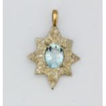 A yellow and white metal (tested gold) pendant set with an oval cut aquamarine and brilliant cut