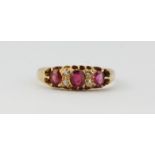 An early 20th century 18ct yellow gold ruby and diamond set ring, (L.5).