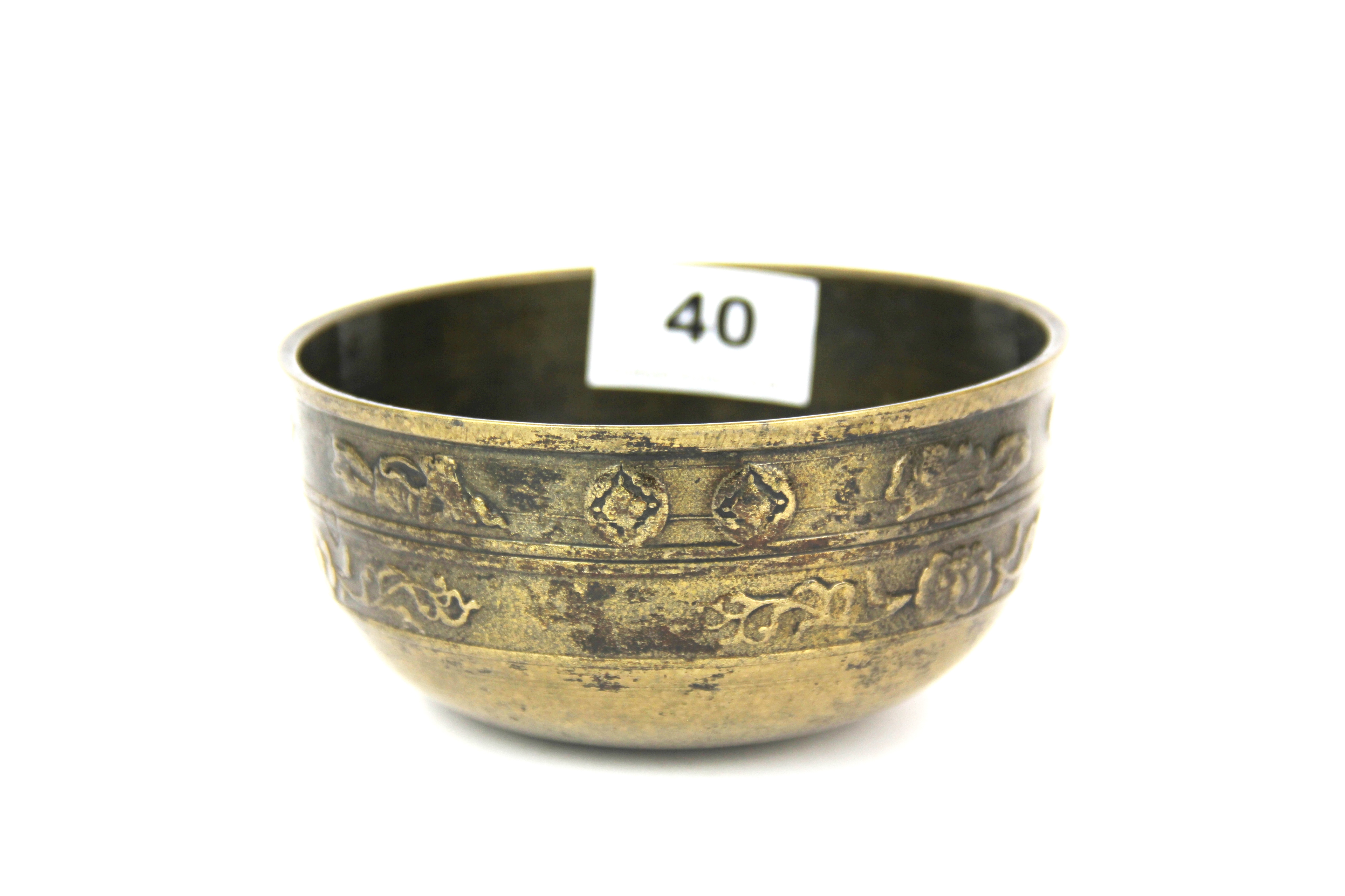 A 19th / early 20th century Tibetan bronze alms bowl, Dia. 12.5cm, H. 6cm.