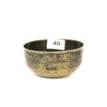 A 19th / early 20th century Tibetan bronze alms bowl, Dia. 12.5cm, H. 6cm.