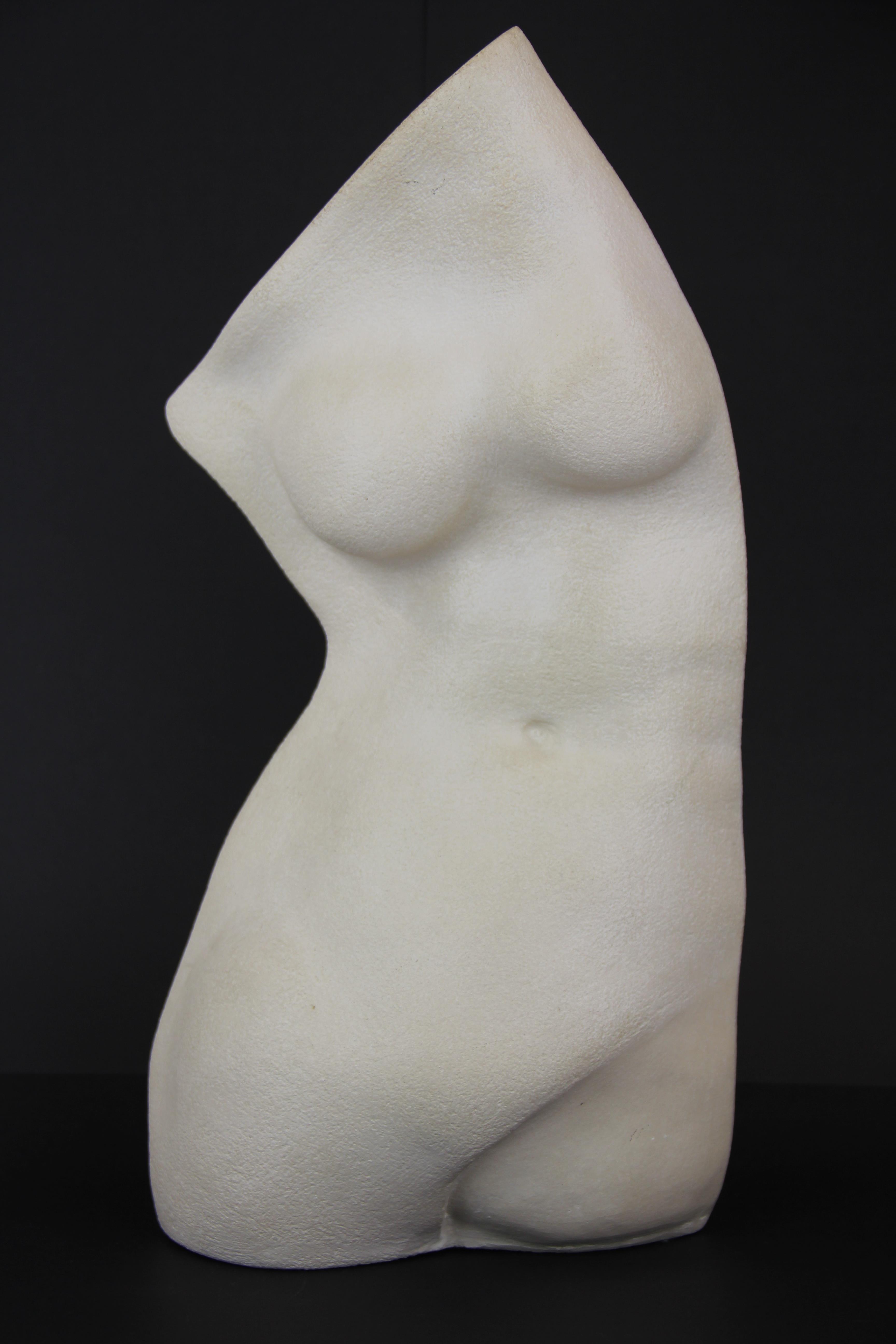 A contemporary ceramic sculpture of a female torso, H. 46cm.