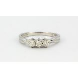 An 850 platinum three diamond ring, approx. 0.33ct, (M.5).