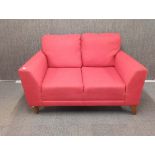 A very comfortable contemporary fabric red sofa.