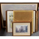 A group of framed prints.