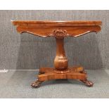 A William IV (1765 - 1837) period carved rosewood and rosewood veneered folding games table with