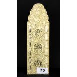 A 19th century Chinese carved ivory cribbage board, 24 x 7.5cm.