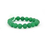 A polished jade bead bracelet, Dia. 9.5mm.