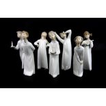 Seven Lladro porcelain figures of children in night gowns, tallest H. 21cm.