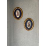 A pair of gilt framed hand painted Sevres style porcelain plaques of cherubs, 28 x 22cm.