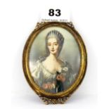 A gilt framed hand painted oval miniature portrait of a lady, 8 x 13cm.