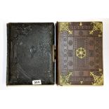 A Victorian leather photograph album (reproduction photos) together with a family bible.