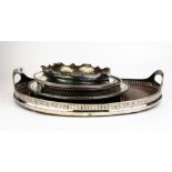 A silver plate and wood gallery tray and five further silver plated salvers, 45 x 31cm.