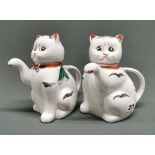 A pair of mid-20th C. Chinese cat shaped porcelain teapots, H. 17cm.