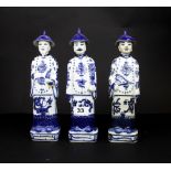 Three Chinese porcelain figures, H. 27cm.
