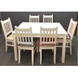 A contemporary painted finish table with six chairs.