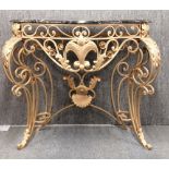 A wrought metal and black marble console table, W. 104cm, H. 94cm.