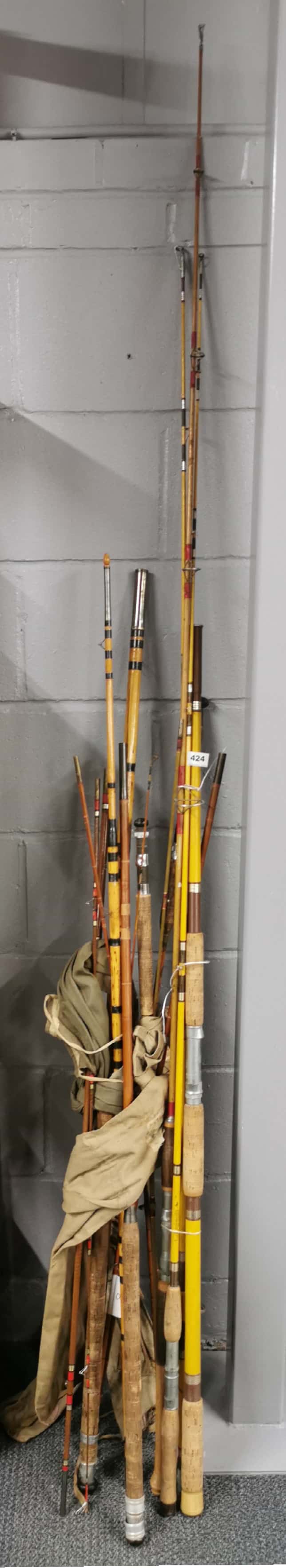 A collection of vintage fishing rods.