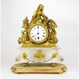 A 19th century gilt metal alabaster clock raised on a wilt wooden pedestal, H. 36cm (with base).