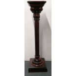 A 19th century carved mahogany plant stand.