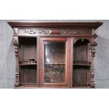 A 19th C. carved mahogany over-mantle/cabinet back, H. 130cm, W. 125cm.