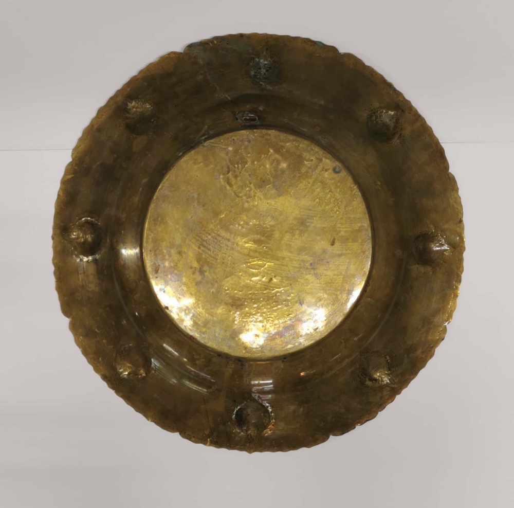 An 18th/19th century hammered brass Mughal charger, Dia. 39.5cm. - Image 2 of 2