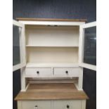 A paint finish farmhouse style kitchen cabinet.