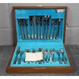 A 1970's teak cased Arthur Price stainless steel cutlery set.