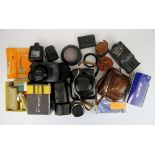 A box of mixed cameras and photographic equipment.